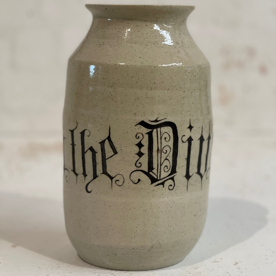 BETWEEN THE DIVINE VASE