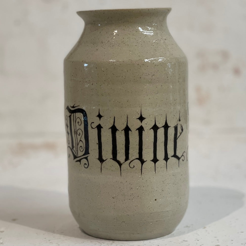 BETWEEN THE DIVINE VASE