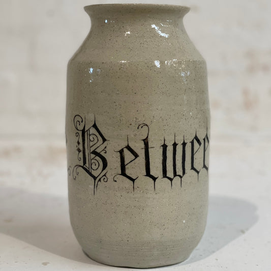 BETWEEN THE DIVINE VASE