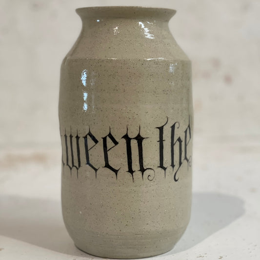 BETWEEN THE DIVINE VASE